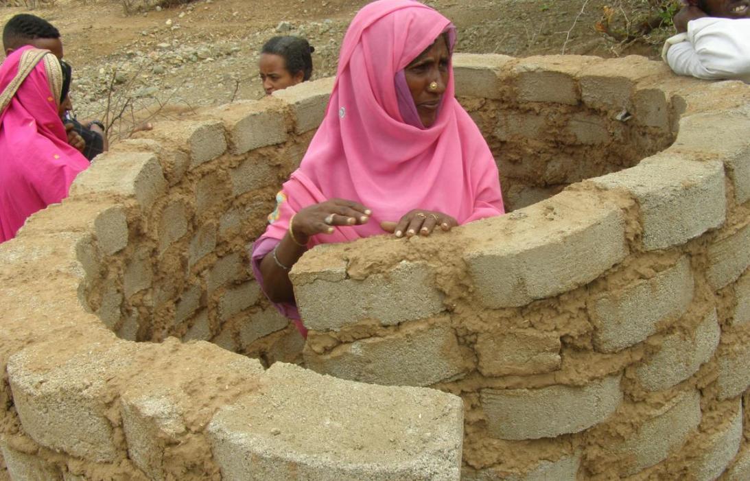 Woman constructing latrine in Wazinet village, Eritrea