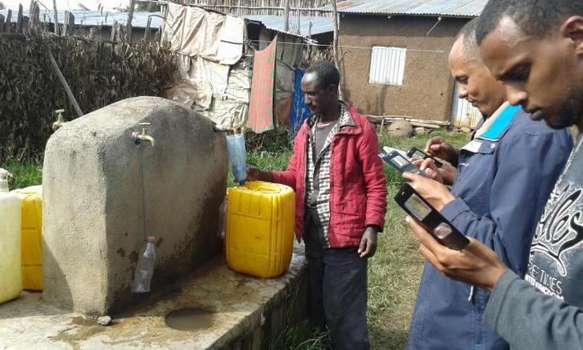 Collecting WASH baseline data with mobile phones at standpipe in Ethiopia