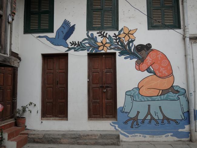 “Holding Up” mural by Caitlin Taguibao. Lalitpur / Patan, Nepal