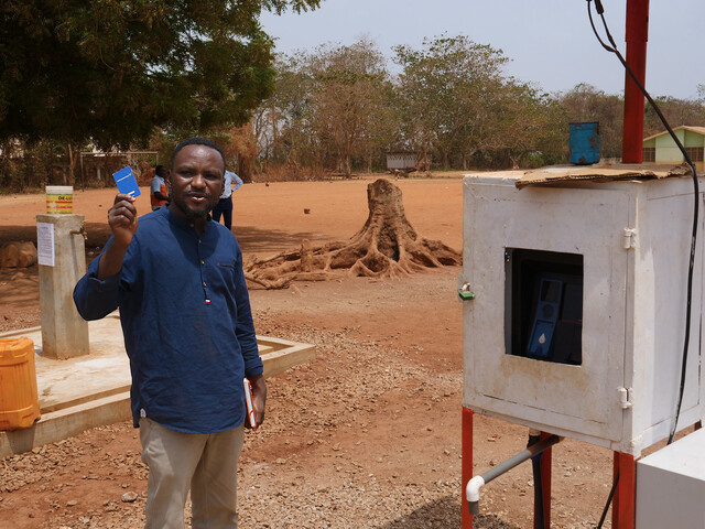 Festus Boadi at the automated water collection point in Kenyasi No 2