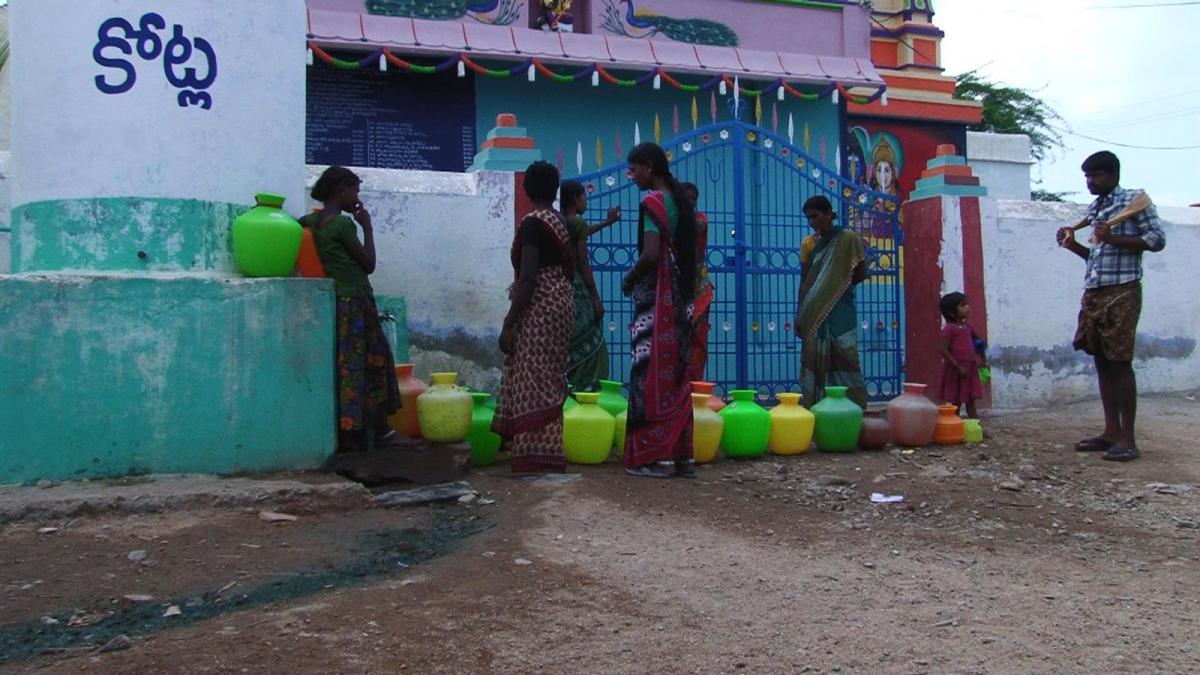End users at water point in India