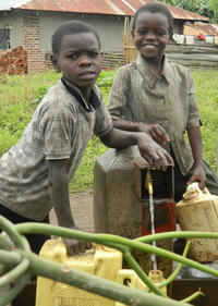 Satisfied users: children fetch water at a tap in Kichwamba sub county, Kabarole District 